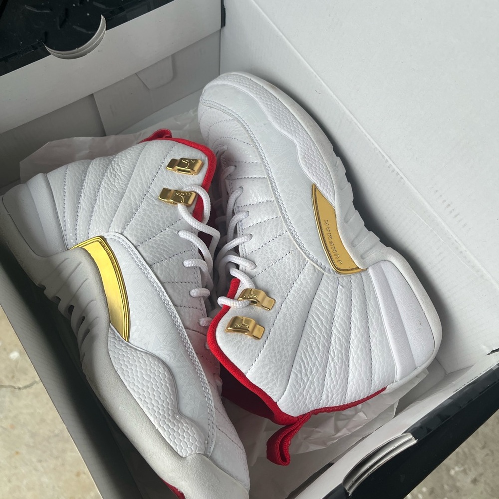 White Air Jordan 12 Retro Sneakers with Red and Gold